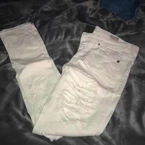 Distressed white jeans